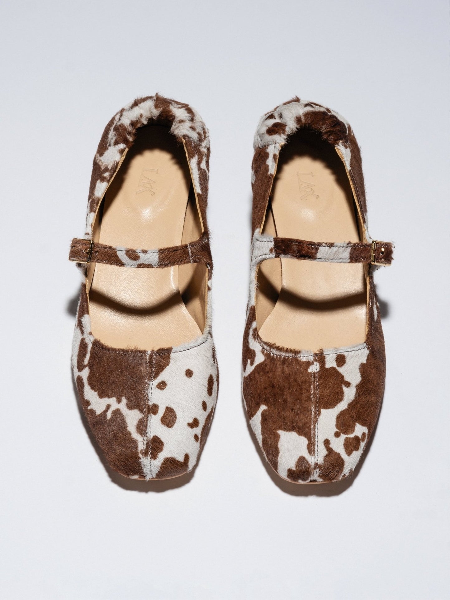 MAGGIE - JANES Cow print pony - LAX